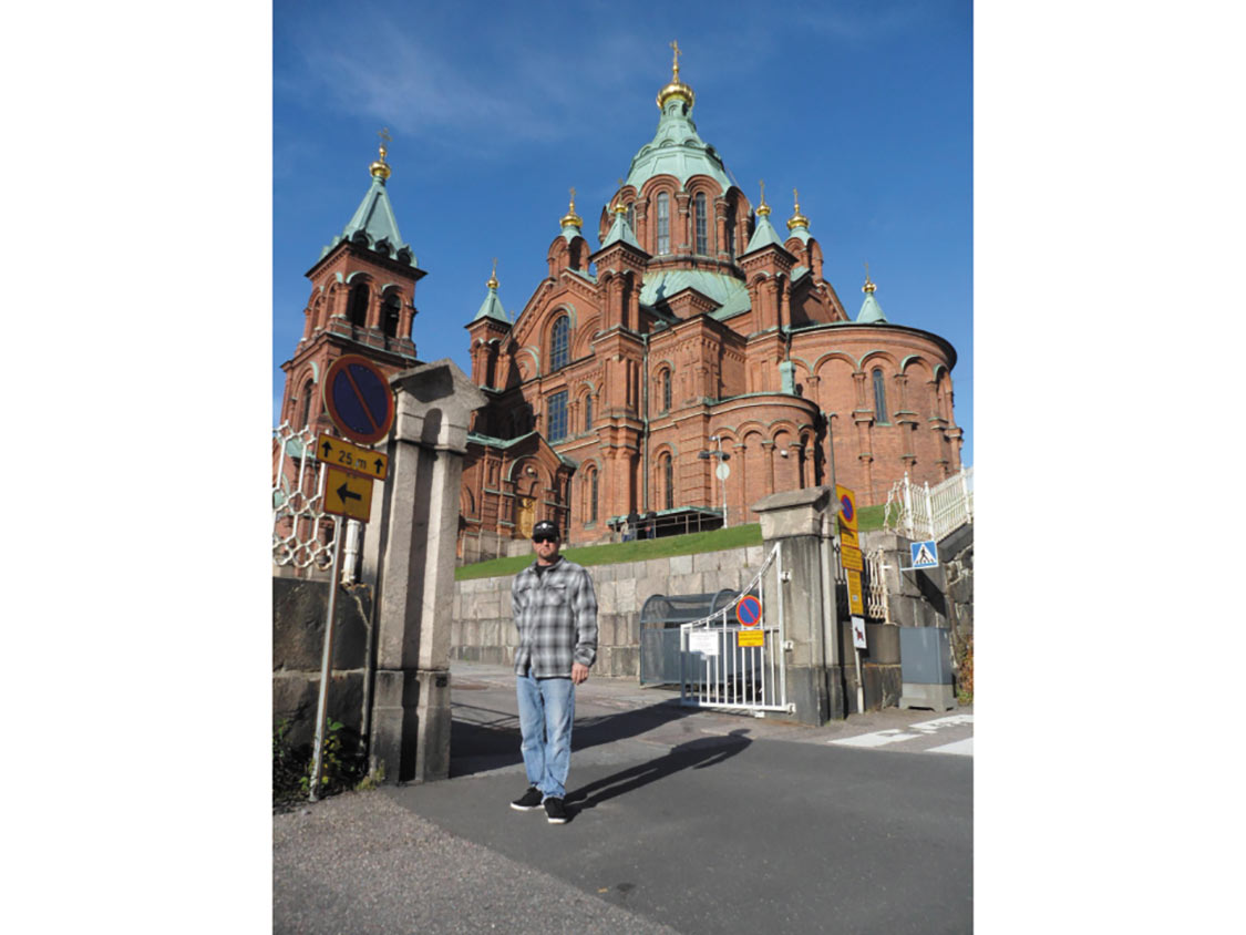 Jimmy Shine stands in front of the Uspenski Cathedral in Helsinki.