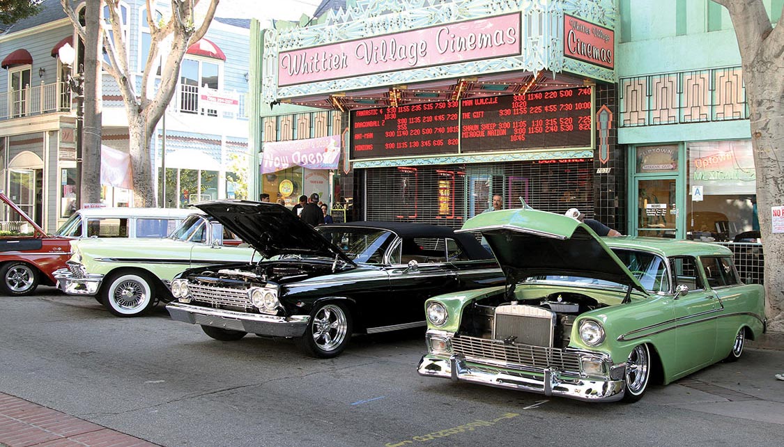 Street rods in front of the historic Whittier Village Cinemas.