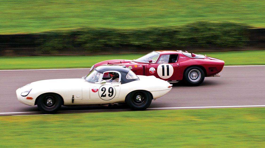1963 Jaguar E-Type Lightweight leads 1966 Bizzarini 3300GT down Lavant Straight RAC TT Celebration