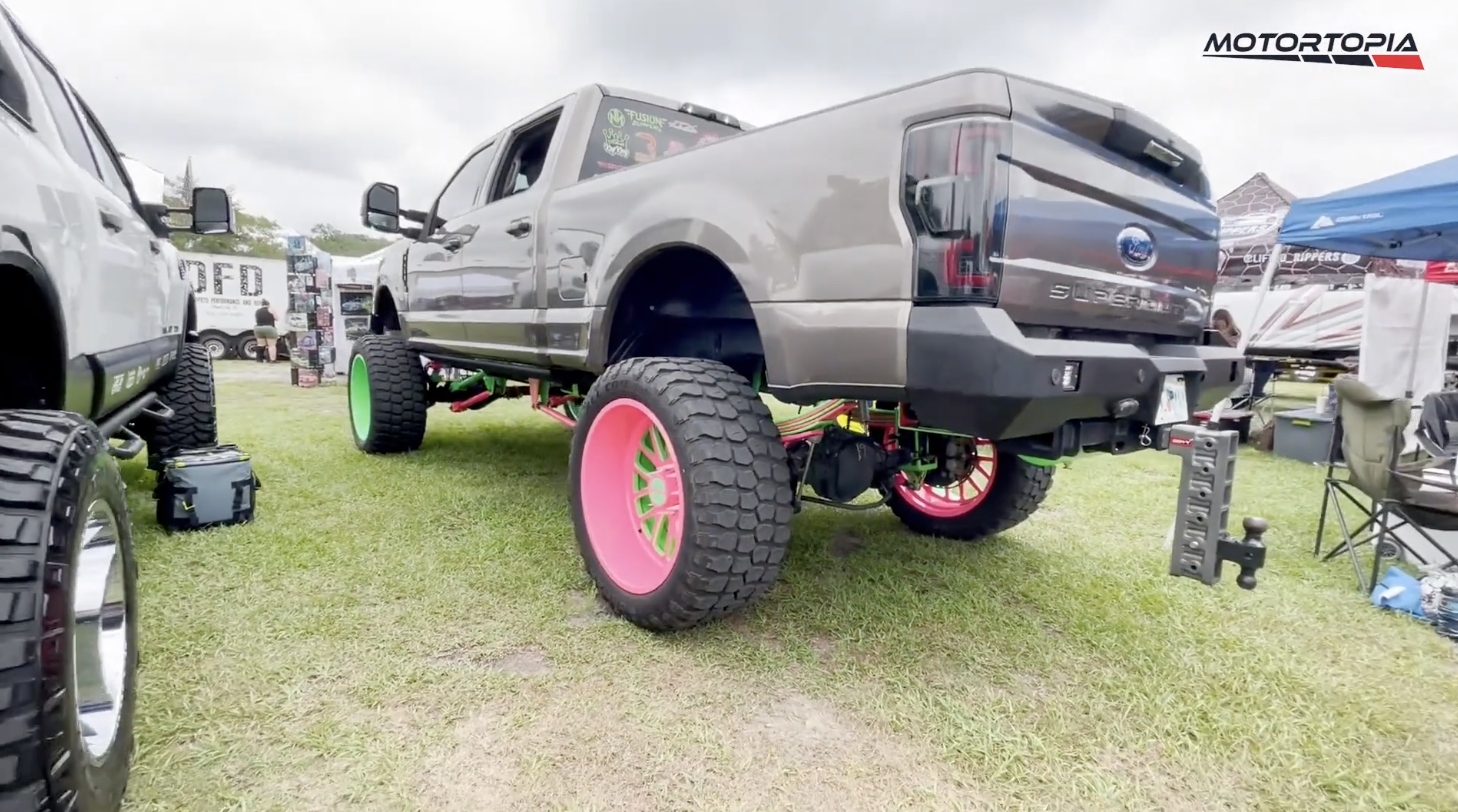 Lifted Ford Super duty with neon suspension.